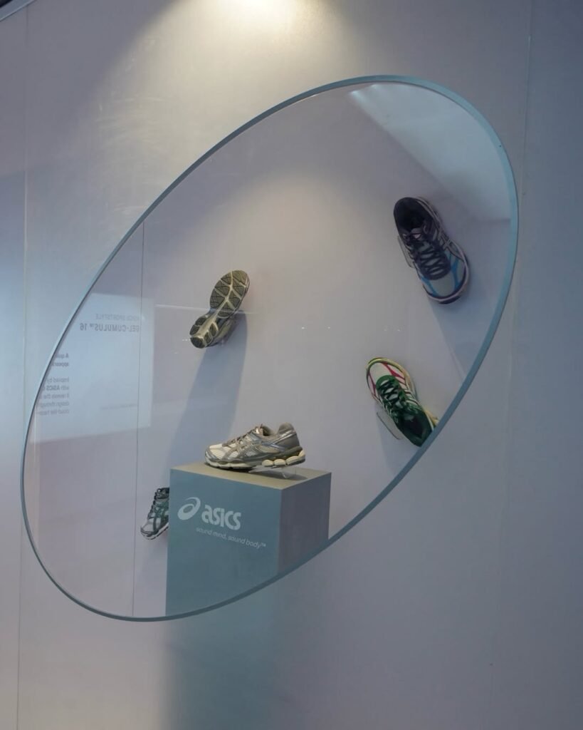ASICS GEL-CUMULUS 16 running shoes on display